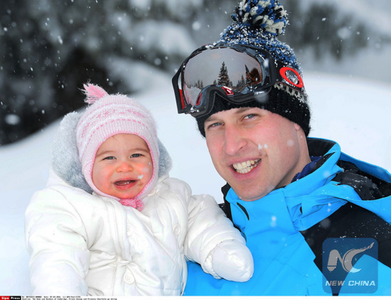 The Duke of Cambridge holds Princess Charlotte as The Duke and Duchess of Cambridge, Prince George and Princess Charlotte enjoy a skiing holiday in the French Alps, France on March 7, 2016. (Xinhua)