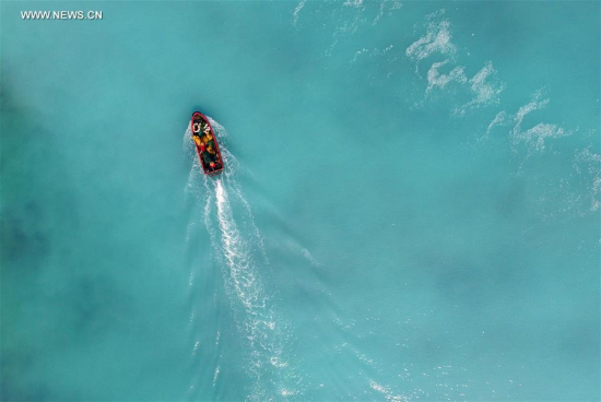 A boat moves on the sea near Zhaoshu Island of Qilianyu Islands in Sansha City, south China's Hainan Province, April 30, 2016. Since Sansha was officially established in 2012, people's lives on Zhaoshu Island have significantly improved by building the power station, seawater desalination plant and the road running around the island. (Xinhua/Yang Guanyu)