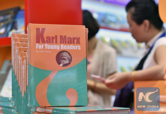 An english version of a book about Karl Marx appears at a book fair in Beijing, on Aug. 26, 2015.(Xinhua)