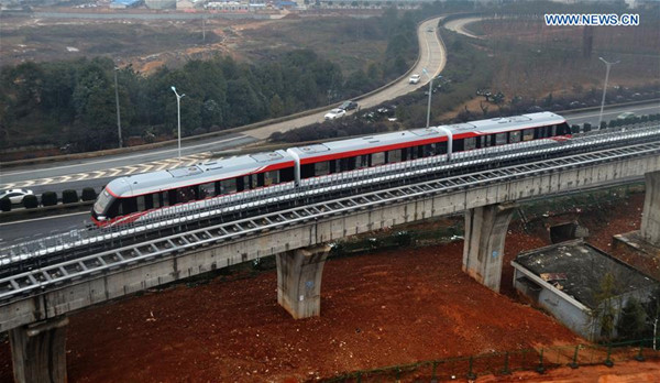 A system debugging is operated on a medium-low speed maglev train in Changsha, capital of central China's Hunan Province, Feb. 2, 2016. China's first domestically designed and manufactured magnetic levitation line, linking Changsha's south railway station and the airport, will be on a trial run with passengers in the first half of the year. It takes about ten minutes to complete the 18.55-km journey. (Xinhua/Long Hongtao)