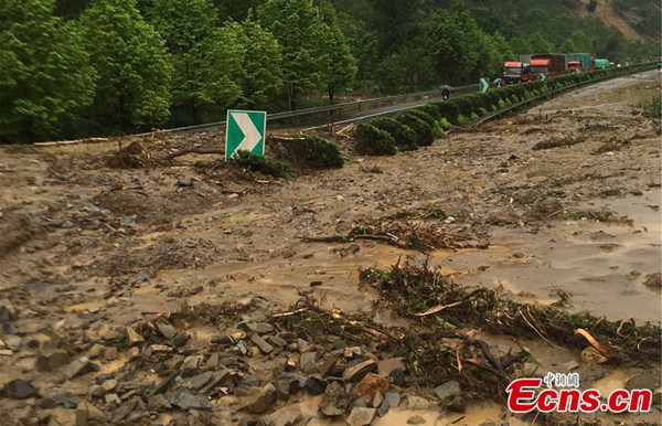 A road is blocked by landslides in Lin'an, East China's Zhejiang Province, May 7, 2016. The western rural area of Lin'an city was hit by strong rain beginning at 2 a.m. on Saturday and some village roads were blocked by landslides. (Photo: China News Service/Sheng Jing)