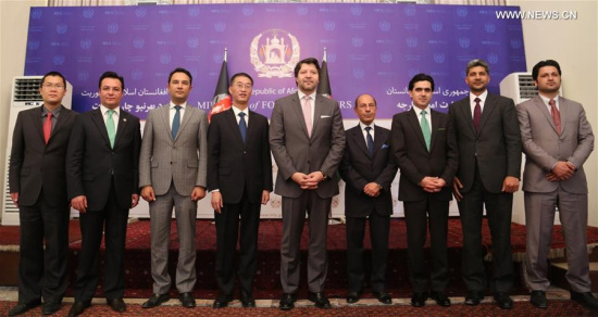 Afghan deputy foreign minister Hekmat Karzai (5th R) and Chinese Ambassador to Afghanistan Yao Jing (4th L) pose for photos during One Belt one Road seminar in Kabul, capital of Afghanistan, May 8, 2016. One Belt One Road seminar, jointly organized by Afghan foreign ministry and Chinese Embassy in Afghanistan, kicked off on Sunday, discussing the opportunity of boosting connectivity and development along the ancient trade route. (Photo: Xinhua/Rahmat Alizadah)