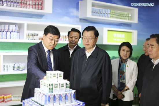 Zhang Dejiang, chairman of the Standing Committee of China's National People's Congress (NPC), inspects the safety supervision of dairy products at Inner Mongolia Yili Industrial Group Co., Ltd. in Hohhot, capital of Inner Mongolia Autonomous Region, May 8, 2016. (Xinhua/Ding Lin)