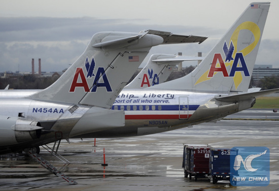 File photo shows American Airlines planes park at Ronald Reagan National Airport in Washington D.C., Nov. 29, 2011. (Photo: Xinhua/Zhang Jun)