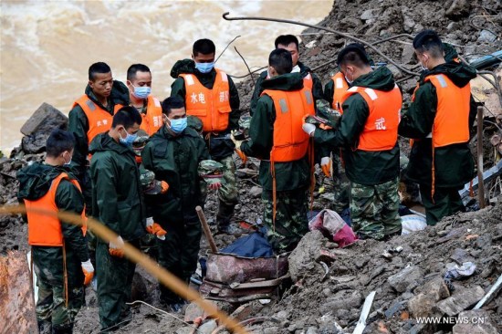 Rescuers pay tribute to the victims at the landslide site in Taining County, southeast China's Fujian Province, May 9, 2016. (Photo: Xinhua/Zhang Guojun)