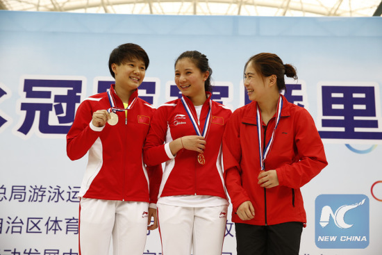 He Zi (C), Shi Tingmao (L) and Huang Xiaohui (R) are on the podium after women's 3m springboard at a national trial in Nanning on May 10, 2016. (Xinhua/Ding Xu)