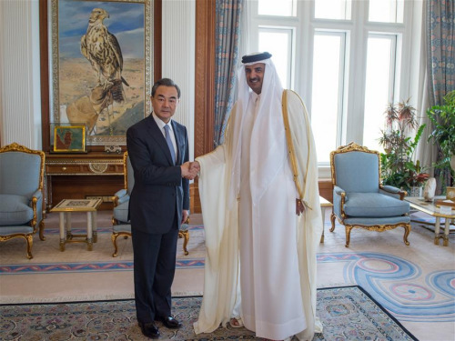 Qatar's head of state, Emir H H Sheikh Tamim Bin Hamad Bin Khalifa Al Thani (R) meets with Chinese Foreign Minister Wang Yi in Doha, Qatar, May 11, 2016. (Photo: Xinhua/Meng Tao)