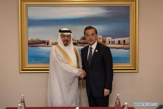Chinese Foreign Minister Wang Yi(R) meets with Dr. Nizar Bin Obaid Madani, minister of State for Foreign Affairs to Saudi Arabia during the 7th Ministerial Meeting of the China-Arab States Cooperation Forum (CASCF) in Doha, Qatar on May 12, 2016. (Photo: Xinhua/Meng Tao)
