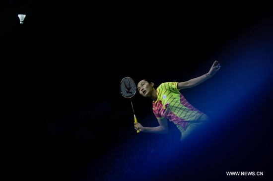 China's Wang Yihan hits a return to Malaysia's Jin Wei Goh during their singles match of Group A at the Uber Cup Badminton Championship in Kunshan, east China's Jiangsu Province, May 15, 2016. Wang Yihan won 2-0. (Photo: Xinhua/Li Xiang)