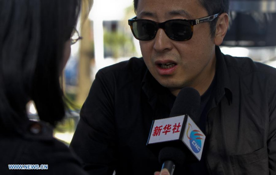 Director Jia Zhangke speaks during an exclusive interview with Xinhua in Cannes, south France, May 20, 2015. (Xinhua file photo)