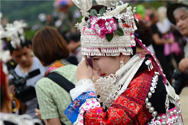 A Miao ethnic woman attends the recent Zimei Jie (Sisters' Day), a five-day festival similar to Valentine's Day, in Taijiang county, Guizhou province.CHINA DAILY