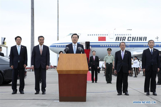  Zhang Dejiang (C, front), chairman of the Standing Committee of China's National People's Congress, speaks upon his arrival at the airport in the Hong Kong Special Administrative Region (SAR), south China, May 17, 2016. (Photo: Xinhua/Pang Xinglei)