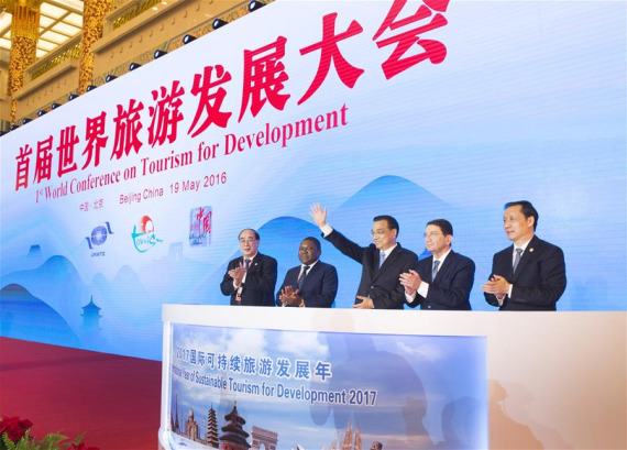 Chinese Premier Li Keqiang (C) attends the opening ceremony of the First World Conference on Tourism for Development in Beijing, capital of China, May 19, 2016. (Photo: Xinhua/Xie Huanchi)
