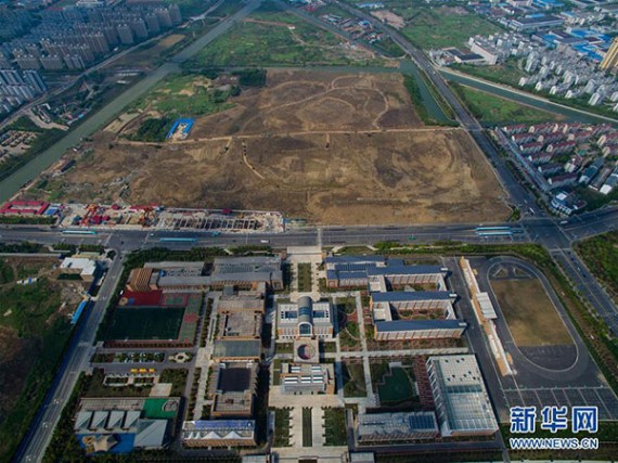 An aerial view of the Changzhou Foreign Languages School in East China's Jiangsu province. The school is located 100 meters from reportedly polluted former site of three chemical plants across the road. (Photo/Xinhua)