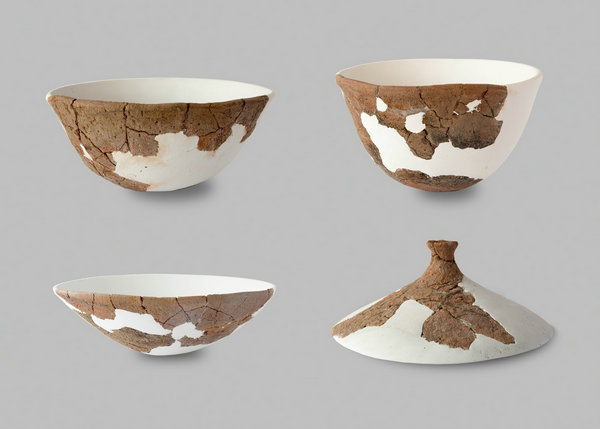 Artifacts unearthed from the Neolithic Age site of Hainan province. (Photo provided to China Daily)