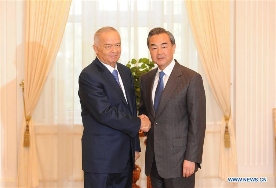 President of Uzbekistan Islam Karimov (L) meets with Chinese Foreign Minister Wang Yi in Tashkent, capital of Uzbekistan on May 23, 2016. (Photo: Xinhua/Sadat)