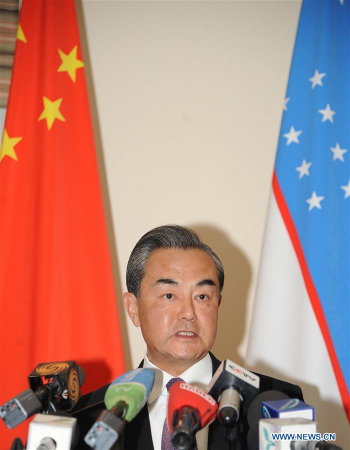 Chinese Foreign Minister Wang Yi addresses reporters after attending a meeting of the Shanghai Cooperation Organization (SCO) foreign ministers in the capital of Uzbekistan on May 24, 2016. (Photo: Xinhua/Sadat)