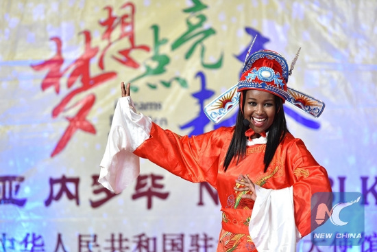 Grace Wagithi Muchiri from Confucius Institute of Nairobi University performs Huangmei opera during the 15th Chinese Bridge Chinese Proficiency Competition for Foreign College Students Kenya Division in Nairobi, Kenya, May 23, 2016. (Photo: Xinhua/Sun Ruibo)