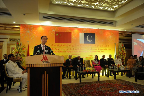 Chinese Ambassador to Pakistan Sun Weidong (front) addresses during a reception to celebrate the 65th anniversary of the establishment of diplomatic relations between China and Pakistan, in Islamabad, capital of Pakistan, May 24, 2016. (Photo: Xinhua/Ahmad Kamal)