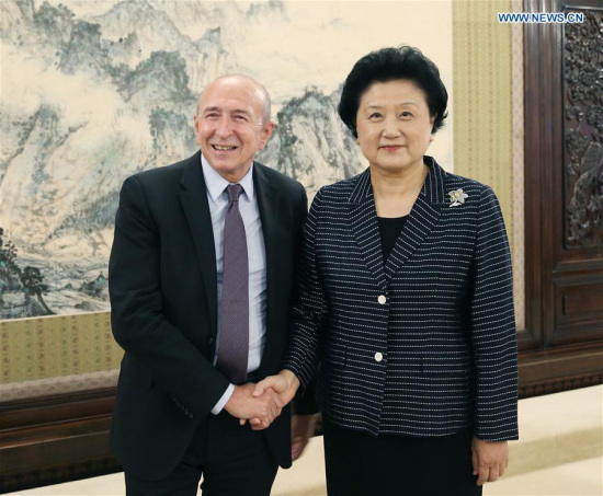 Chinese Vice Premier Liu Yandong (R) meets with Gerard Collomb, mayor of Lyon, France, in Beijing, capital of China, May 25, 2016. (PhotoXinhua/Yao Dawei)