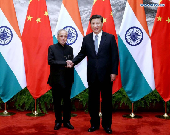 Chinese President Xi Jinping (R) shakes hands with Indian President Pranab Mukherjee in Beijing, capital of China, May 26, 2016. (Photo Xinhua/Liu Weibing)