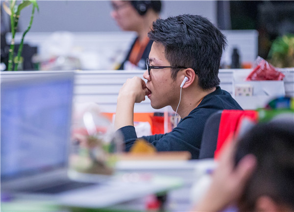 A young man at work in an office in Hangzhou, capital of Zhejiang province. Cybersecurity is receiving increasing attention in China.CHINA DAILY