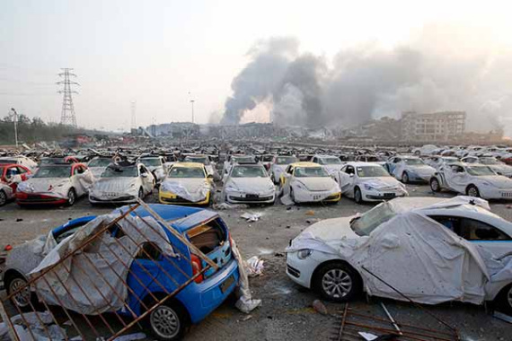 Damaged cars are pictured in Tianjin Port on Aug 13, 2015. (Shan Haihan / For China Daily) Damaged cars are pictured in Tianjin Port on Aug 13, 2015. (Shan Haihan / For China Daily)