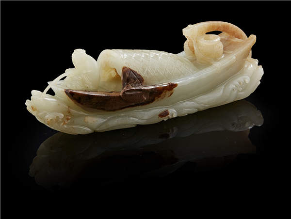 A Qing Dynasty celadon jade carving of a boat.