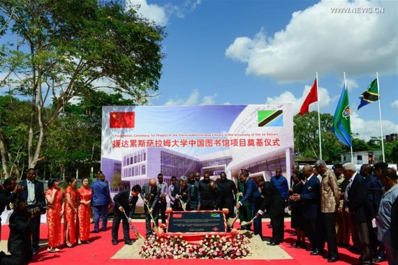 Tanzanian President John Magufuli (3rd R, front), Tanzanian former President Jakaya Mrisho Kikwete (2nd R, front) and Chinese ambassador to Tanzania Lv Youqing (3rd L, front) attend the foundation ceremony of China-aided Chinese Library at the University of Dar es Salaam (UDSM), Tanzania, on June 2, 2016. (Photo/Xinhua)