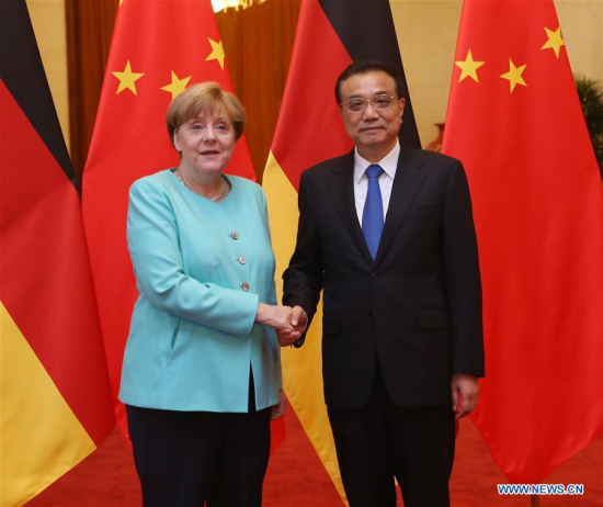 Chinese Premier Li Keqiang (R) shakes hands with German Chancellor Angela Merkel at a welcoming ceremony for Merkel before their talks at the Great Hall of the People in Beijing, capital of China, June 13, 2016. (Xinhua/Liu Weibing)