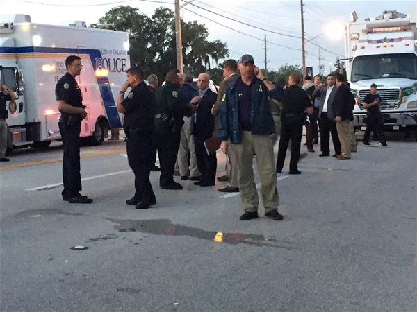 Photo provided by Orlando Police Department shows police officers at the site of the shooting incident in Orlando, Florida, the United States, June 12, 2016. (Xinhua/Orlando Police Department)
