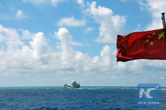 A fleet of fishing vessels arrive at Zhubi Reef of the South China Sea on July 18, 2012. The fleet of 30 boats, the largest ever launched from China's southernmost province of Hainan, planned to fish and detect fishery resources near Zhubi Reef. (Photo: Xinhua/Wang Cunfu)