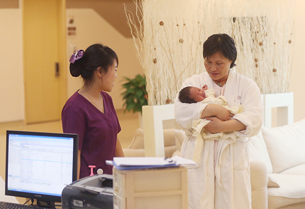 A baby born at a private maternity hospital in Beijing. More and more well-off Chinese are turning to privately owned hospitals for their high-end conditions and services. (Wang Yuyi/For China Daily)