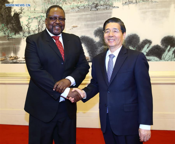 Chinese State Councilor and Minister of Public Security Guo Shengkun (R) meets with South African Police Minister Nathi Nhleko in Beijing, capital of China, May 4, 2016. (Photo: Xinhua/Ding Haitao)