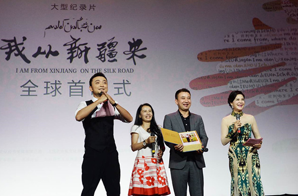 Two people from Xinjiang in the documentary are on the stage to meet audience on Monday. (Photo/provided to chinadaily.com.cn)