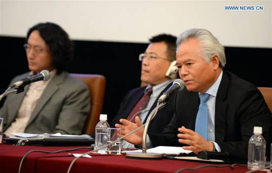Wu Shicun (R), president of China's National Institute for South China Sea Studies, speaks during a press conference in Tokyo, Japan, June 24, 2016. (Xinhua/Ma Ping)