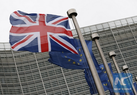 Photo taken on Jan. 29, 2016 shows the UK and EU flags outside the European Commission headquarters in Brussels, Belgium. (Xinhua/Ye Pingfan)