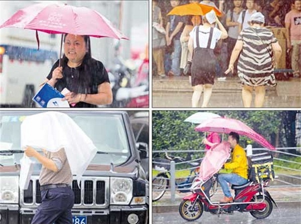 People struggle to keep dry as a sudden rainstorm hits the city yesterday. Over 140 flights were canceled and 120 were delayed at Shanghais two airports because of the storm.(Zhu Weihui)