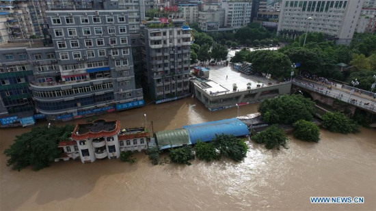 Photo taken on June 28, 2016 shows flood in the Qijiang District of Chongqing, southwest China.  (Photo/Xinhua)