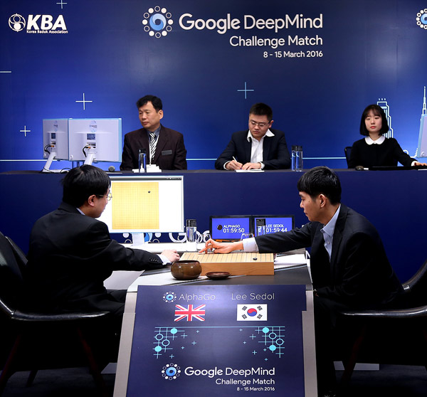 Go player Lee Sedol puts the first stone against Google's artificial intelligence program AlphaGo during the second day of Google DeepMind Challenge Match in Seoul, South Korea, March 10, 2016. (Photo/Xinhua)