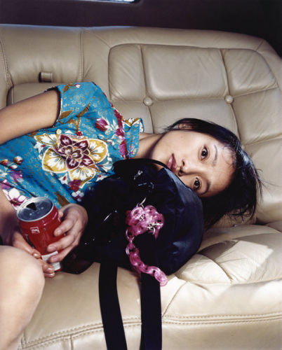 Chinese actress Zhou Xun relaxes in a limousine in November 2002, Shanghai. (Photo provided to China Daily)