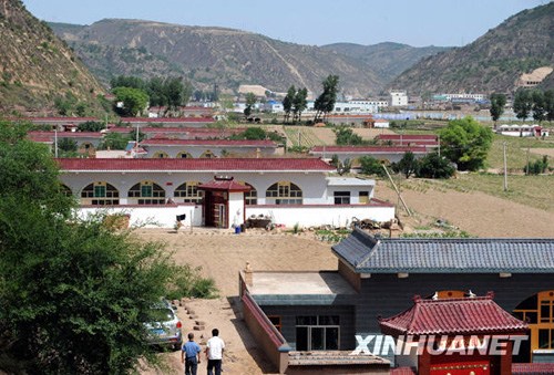 The photo taken on June 9, 2009 shows residential buildings in Wuqi county. (Photo/ Xinhua)