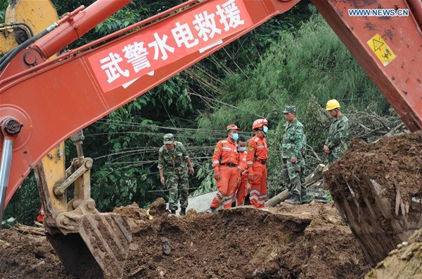 Rescuers work at the disaster site after a rain-triggered landslide hit Pianpo Village, Dafang County in the city of Bijie, southwest China's Guizhou Province, July 2, 2016. The landslide on Friday morning has caused 20 people dead, seven injured and three missing. 27 people have been rescued by now. (Xinhua/Yang Ying)