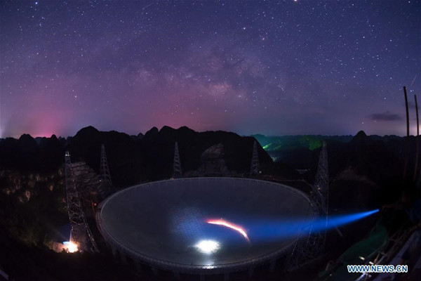 Photo taken on June 27, 2016 shows the Five-hundred-meter Aperture Spherical Telescope, or FAST, at night in Pingtang County, southwest China's Guizhou Province. Construction of the world's largest telescope FAST started in March 2011. The telescope will be used to detect and collect signals and data from the universe. (Xinhua/Liu Xu)