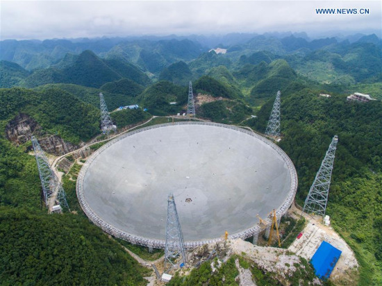  The aerial photo taken on July 3, 2016 shows the Five-hundred-meter Aperture Spherical Telescope (FAST) in Pingtang County, southwest China's Guizhou Province. (Xinhua/Liu Xu)