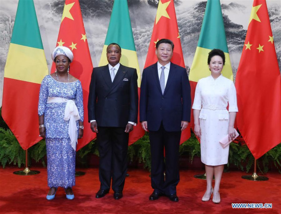 Chinese President Xi Jinping (2nd R), his wife Peng Liyuan (1st R)pose for a group photo with Republic of Congo President Denis Sassou Nguesso (2nd L) and his wife Antoinette Sassou Nguesso(1st L) outside the Great Hall of the People in Beijing, capital of China, July 5, 2016. (Xinhua/Yao Dawei)