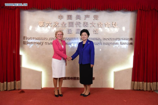 Chinese Vice Premier Liu Yandong (R) shakes hands with Russian Deputy Prime Minister Olga Golodets during the inauguration of the exhibition hall at the site of the Sixth National Congress of the Communist Party of China in Moscow, Russia, July 4, 2016.  (Xinhua/Dai Tianfang) 