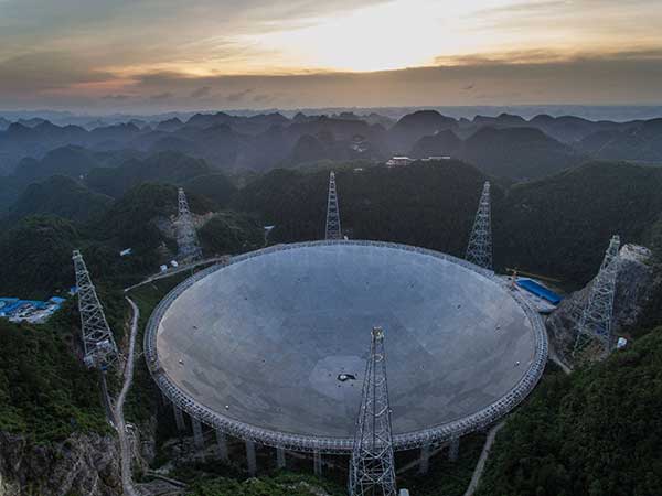 The 500 meter aperture spherical telescope in Pingtang county, Guizhou, to be completed in September, is expected to be the world's largest, overtaking Puerto Rico's Arecibo Observatory, which is 300 meters in diameter.(Photo/Xinhua)