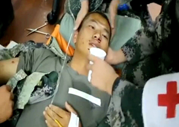 A Chinese UN peacekeeper receives treatment after being injured when his vehicle was hit by mortar fire on Sunday in Juba, South Sudan, in this screen shot from CCTV.