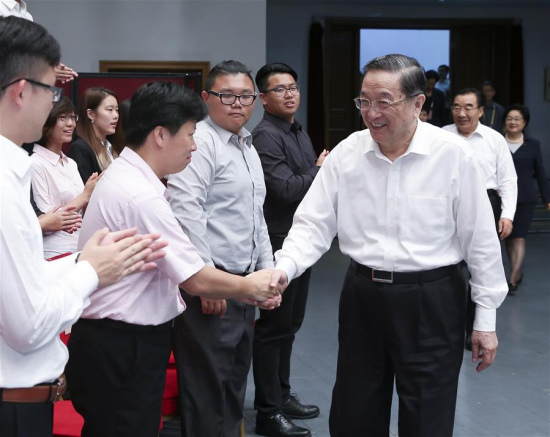 Yu Zhengsheng (R, front), chairman of the National Committee of the Chinese People's Political Consultative Conference (CPPCC), meets with a youth delegation from Taiwan, in Beijing, capital of China, July 12, 2016. (Xinhua/Pang Xinglei)